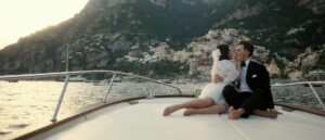 elopement on a boat in front of positano