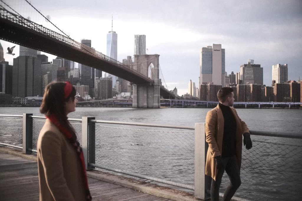 franch couple with background of nyc
