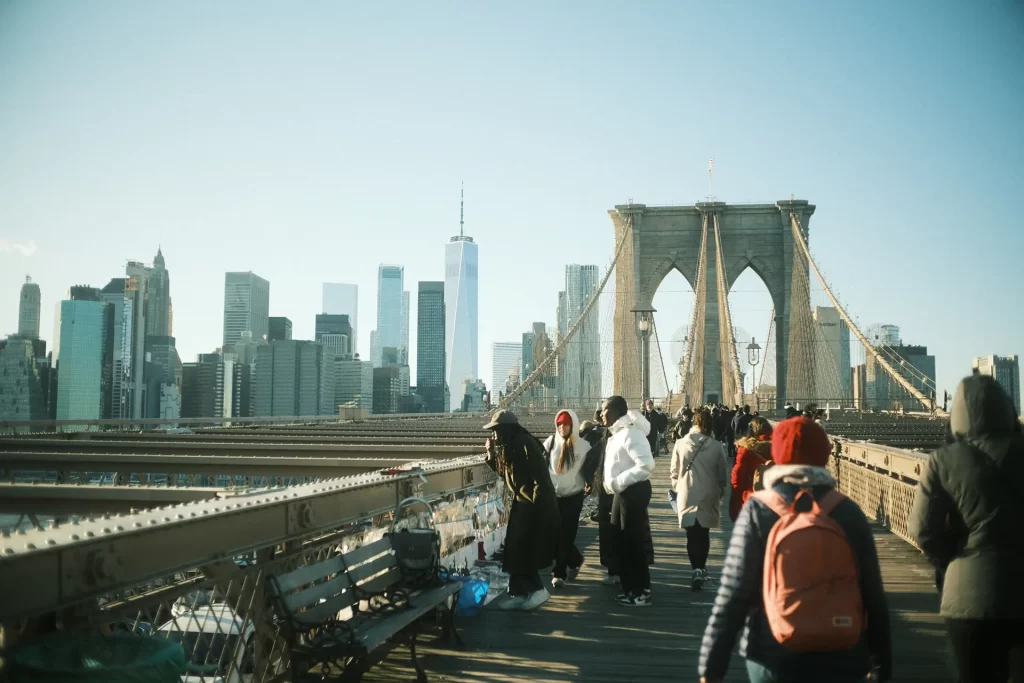 people strolling on the Brooklyn Bridge