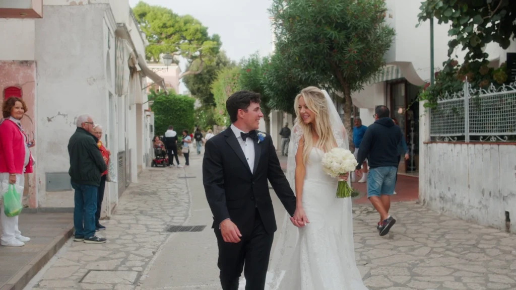 The newlyweds walking through Capri's streets