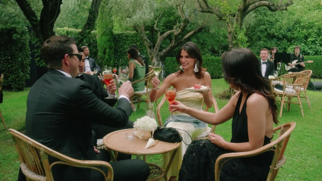 The guests having a toast in the garden of Il Palagio estate