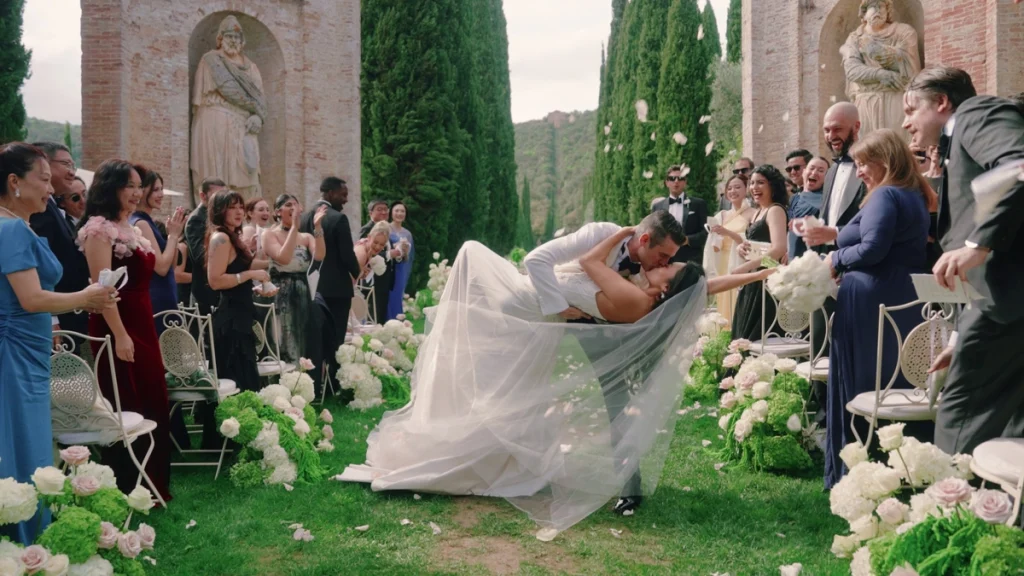 The bride and the groom kissing right after the ceremony 