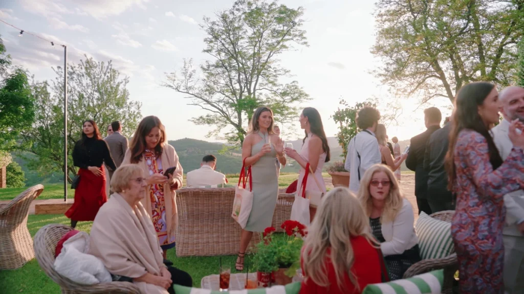 The guests chatting in Castello di Casole 's garden
