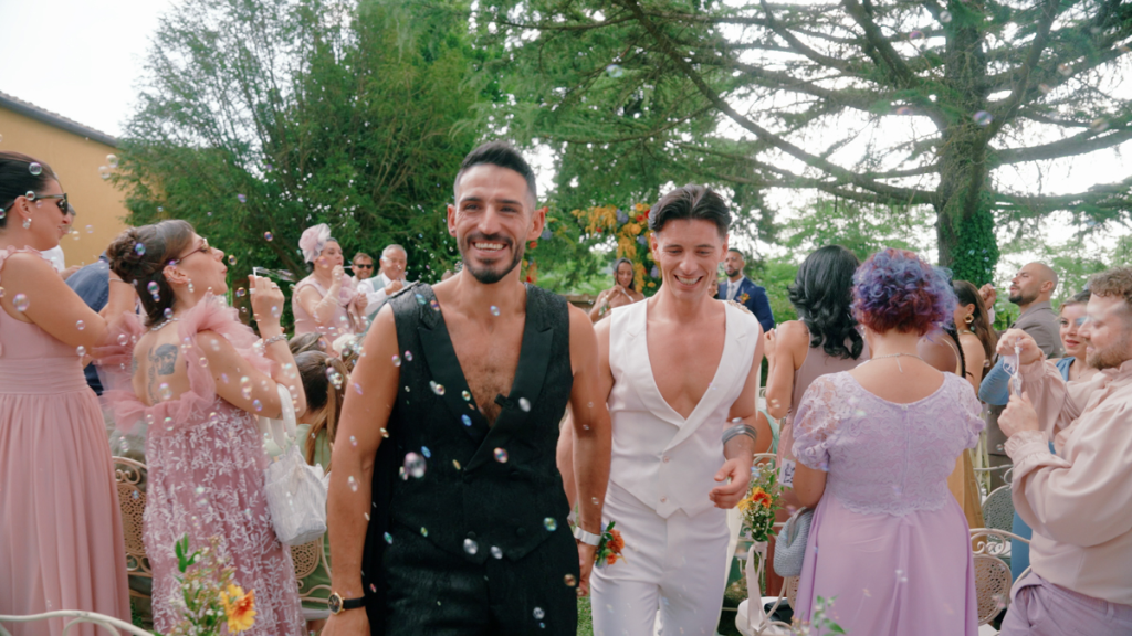 Mattia and Thomas are cheered by their guests after the ceremony