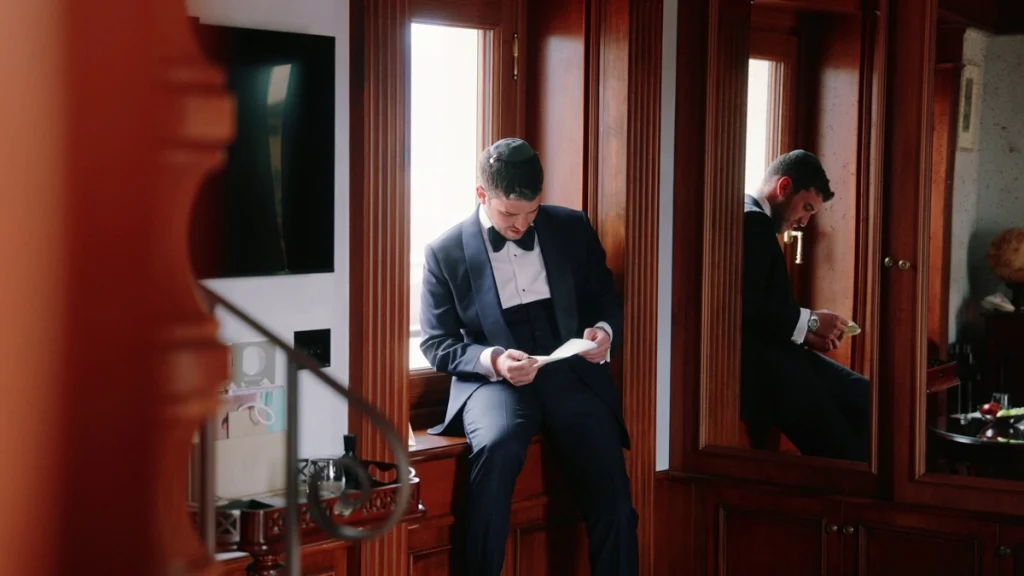 The groom reads his wedding vows
