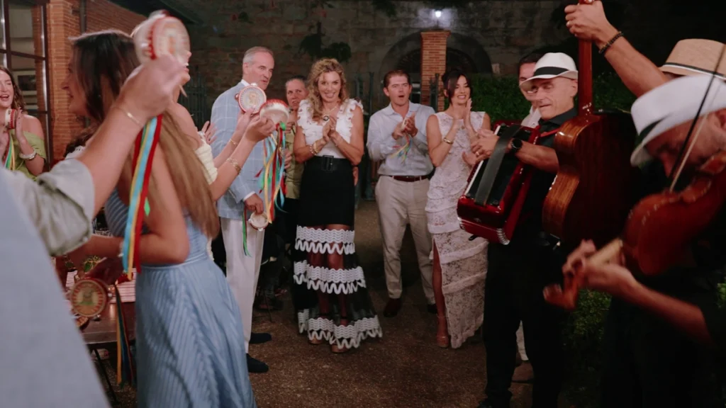 Guests dancing and singing during the welcome dinner