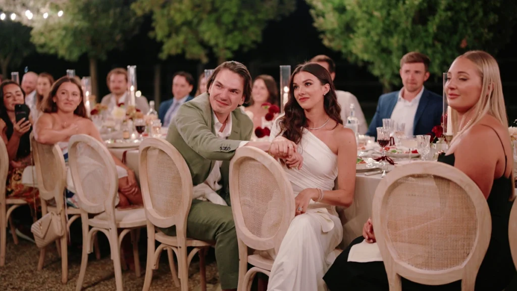 The newlyweds listen to their wedding speeches