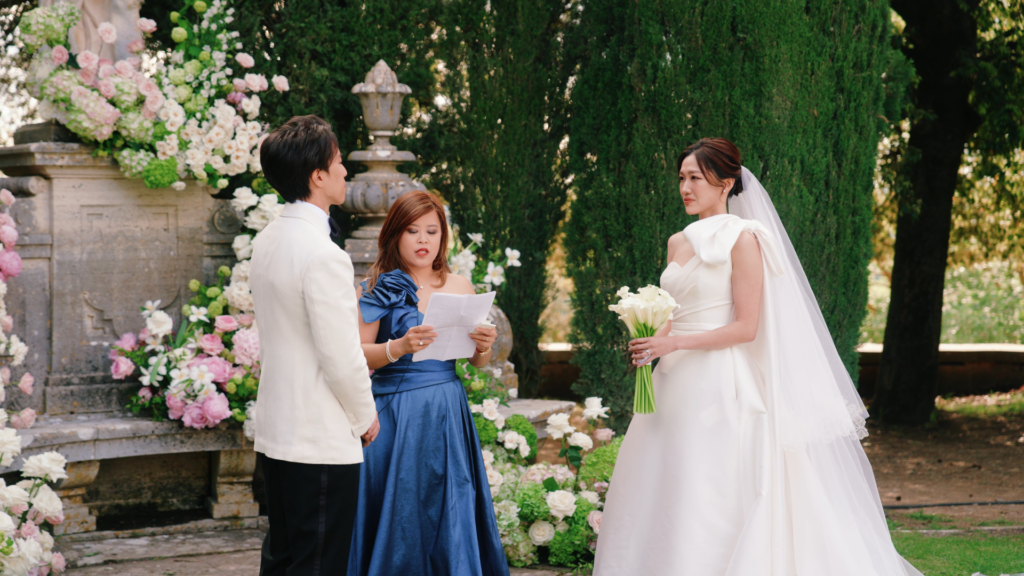 The newlyweds exchanging vows at Villa La Foce, Tuscany