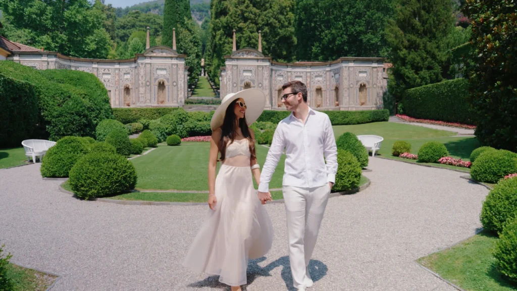 The couple strolls through the gardens of Villa d'Este
